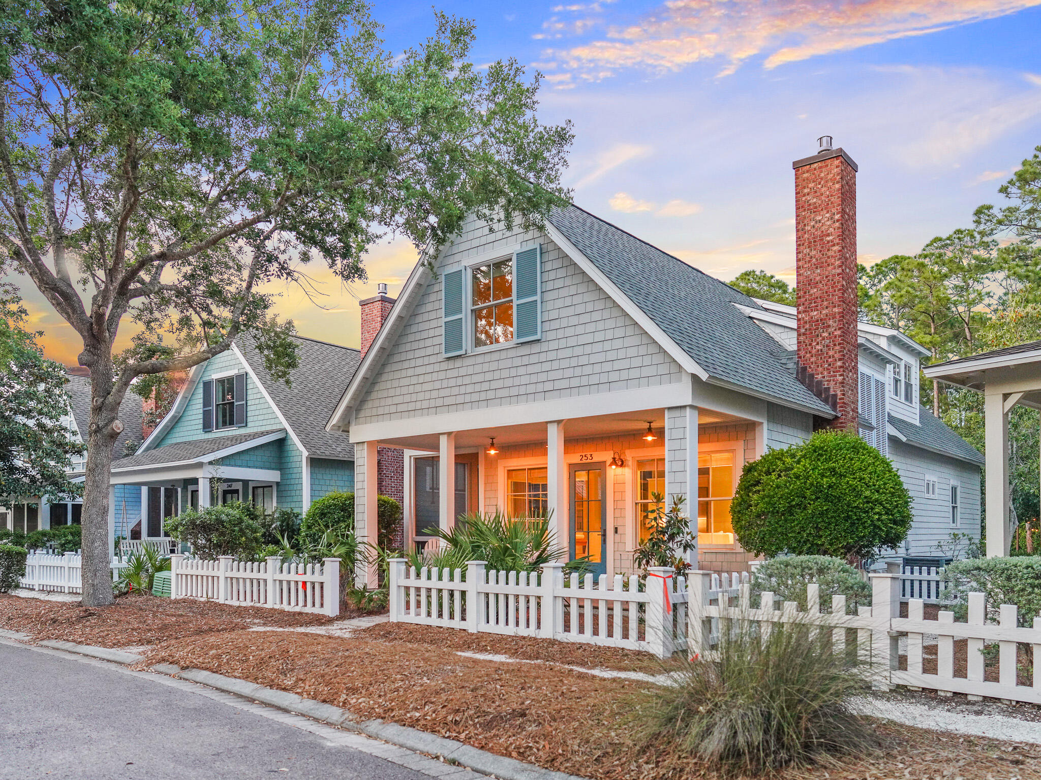 253 Salt Lane Watersound, FL 32461 - Photo 49 of 56 a front view of a house with a garden