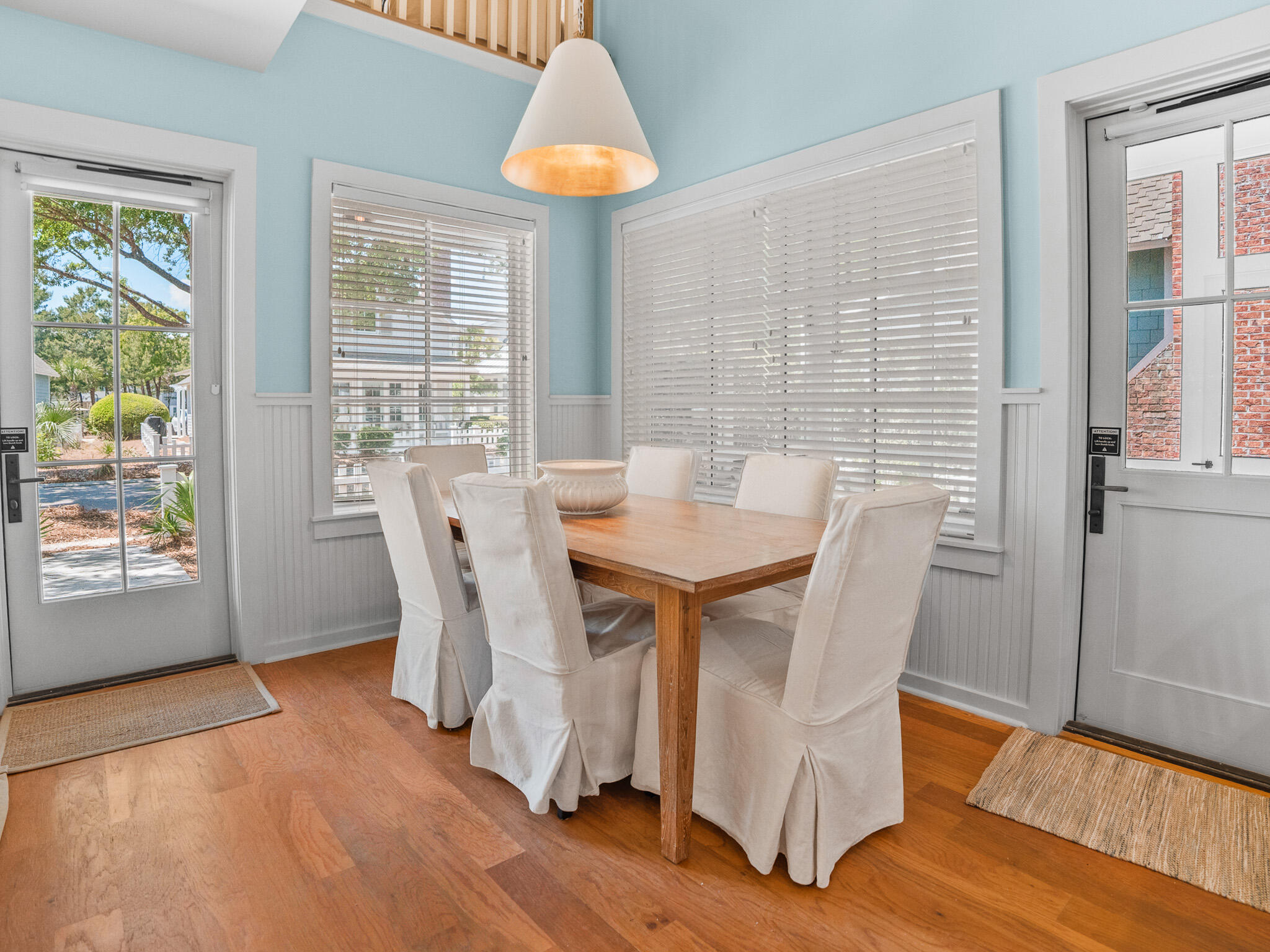 253 Salt Lane Watersound, FL 32461 - Photo 8 of 56 a view of a dining room with furniture window and wooden floor