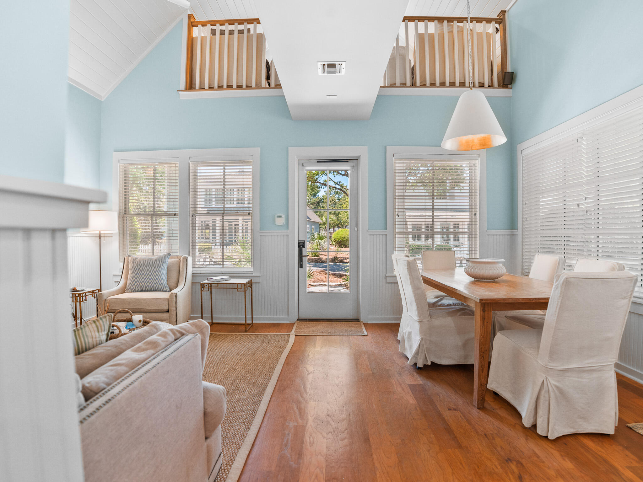 253 Salt Lane Watersound, FL 32461 - Photo 9 of 56 a living room with furniture a wooden floor and a large window