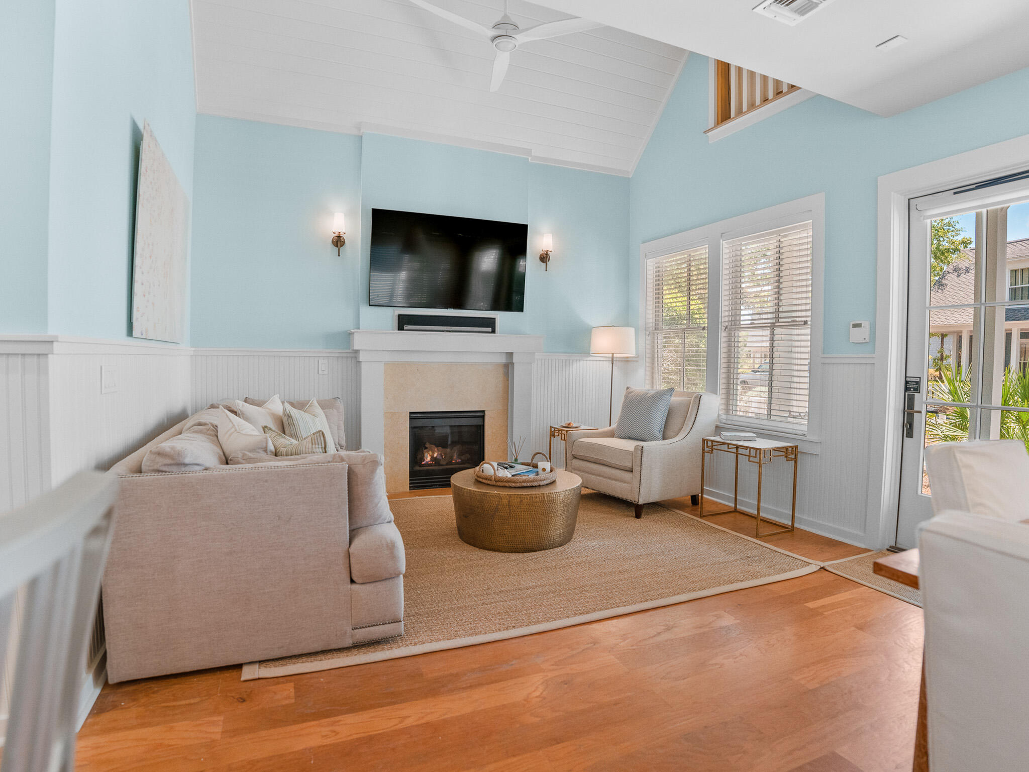 253 Salt Lane Watersound, FL 32461 - Photo 10 of 56 a living room with furniture a flat screen tv and a fireplace