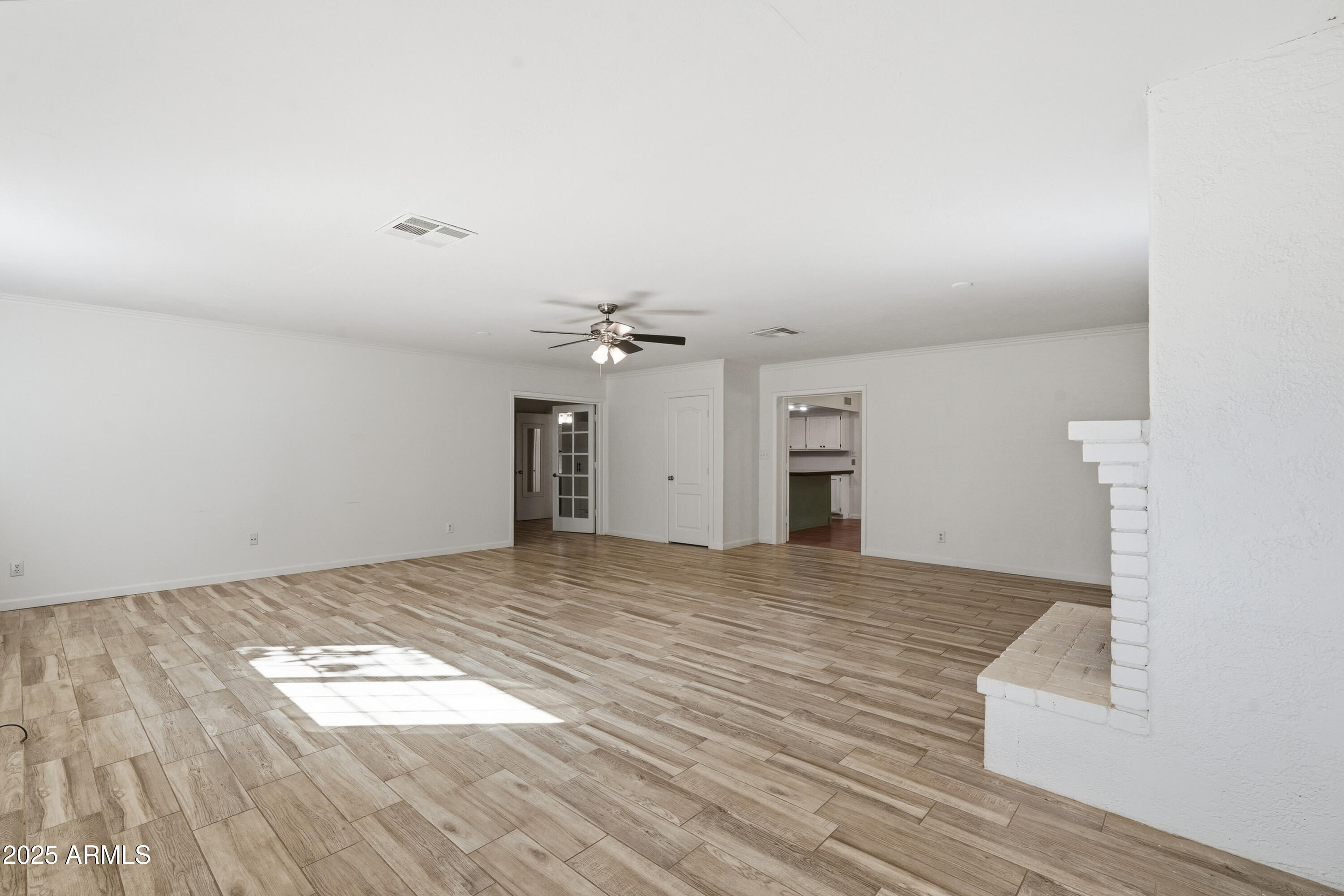 21047 South 156th Street Gilbert, AZ 85298 - Photo 11 of 40 a view of empty room with wooden floor
