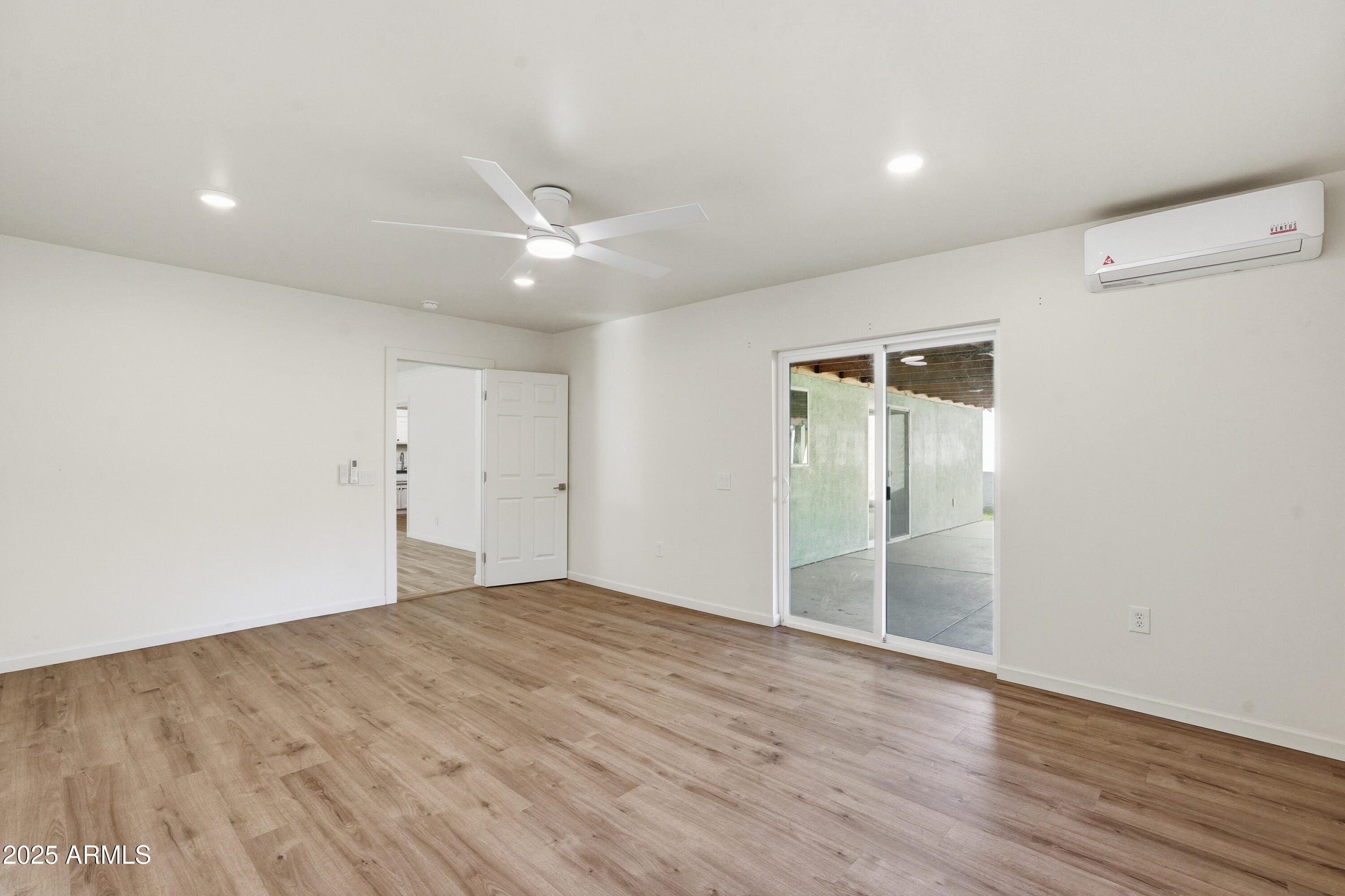 21047 South 156th Street Gilbert, AZ 85298 - Photo 13 of 40 wooden floor in an empty room with a window