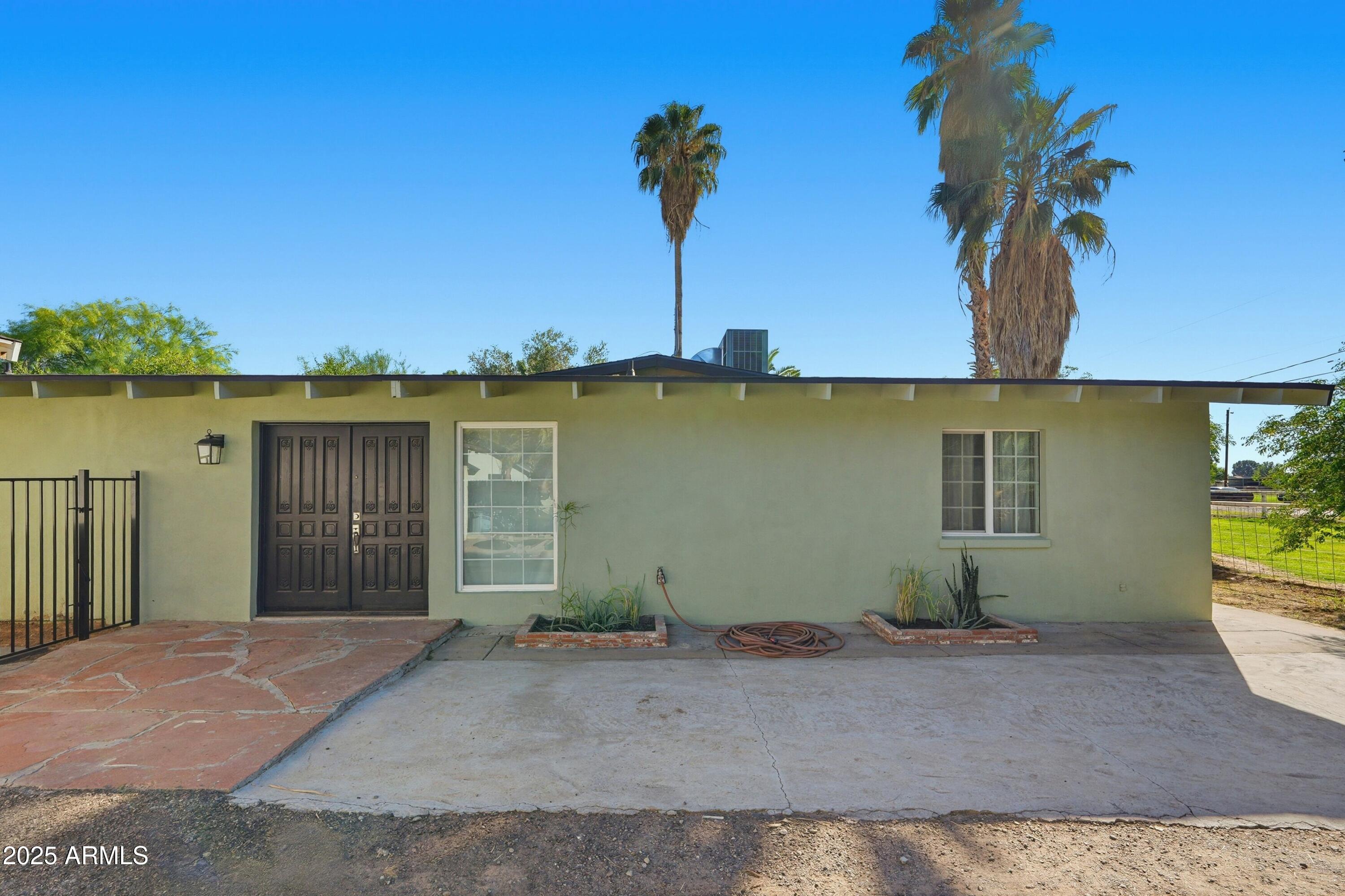 21047 South 156th Street Gilbert, AZ 85298 - Photo 2 of 40 a front view of a house with lake view