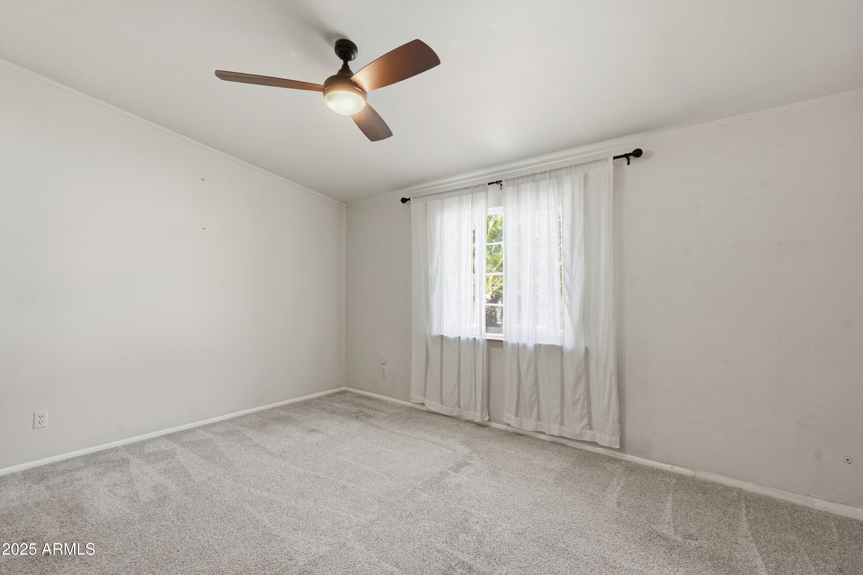 21047 South 156th Street Gilbert, AZ 85298 - Photo 21 of 40 an empty room with ceiling fan and windows