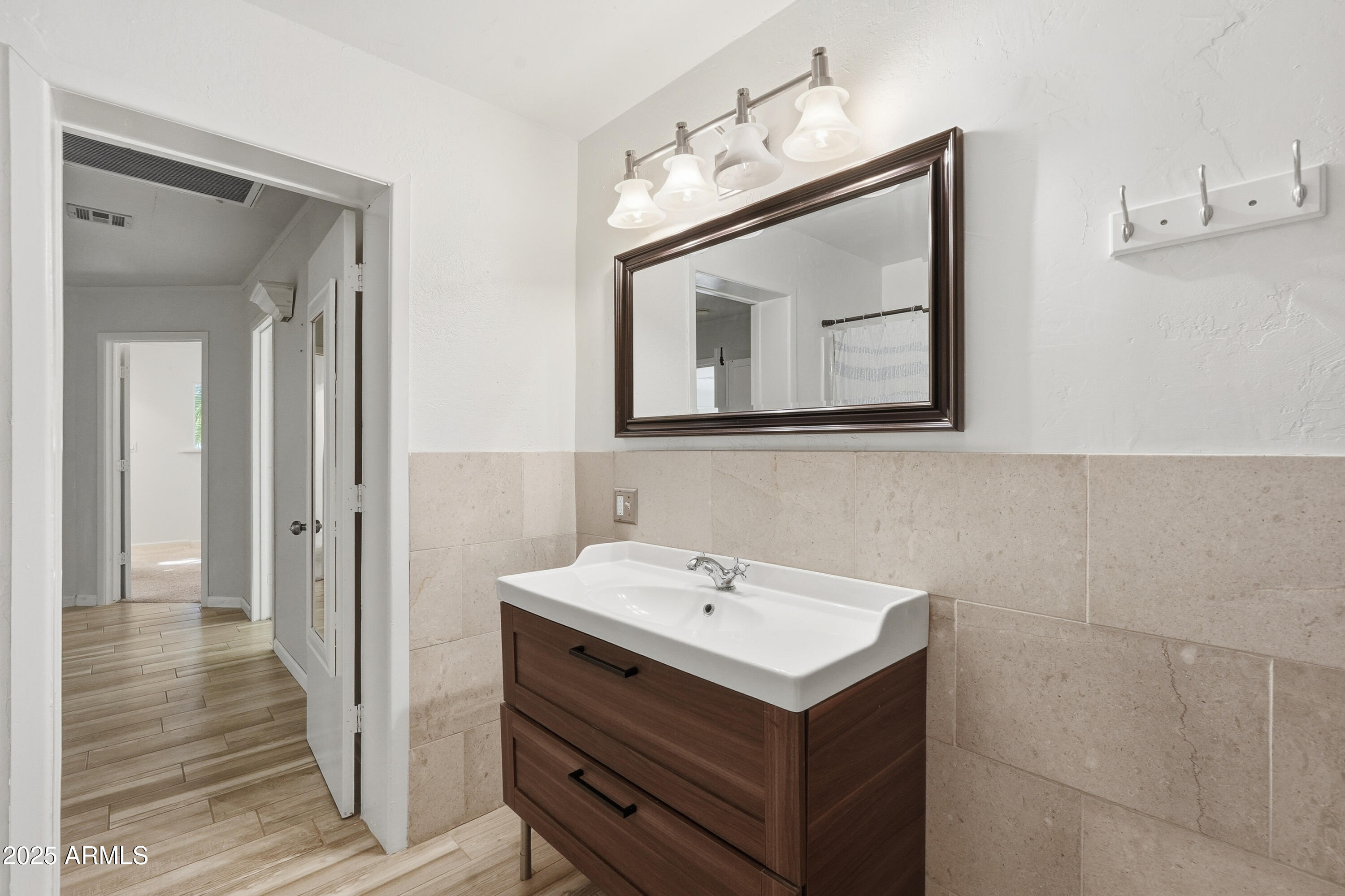 21047 South 156th Street Gilbert, AZ 85298 - Photo 30 of 40 a bathroom with a sink and a mirror