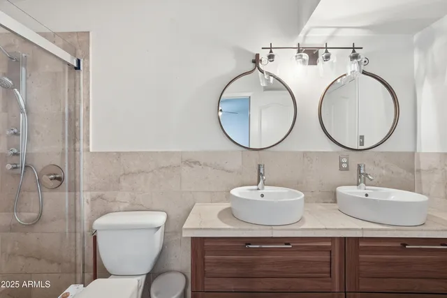 a bathroom with a bathtub and windows