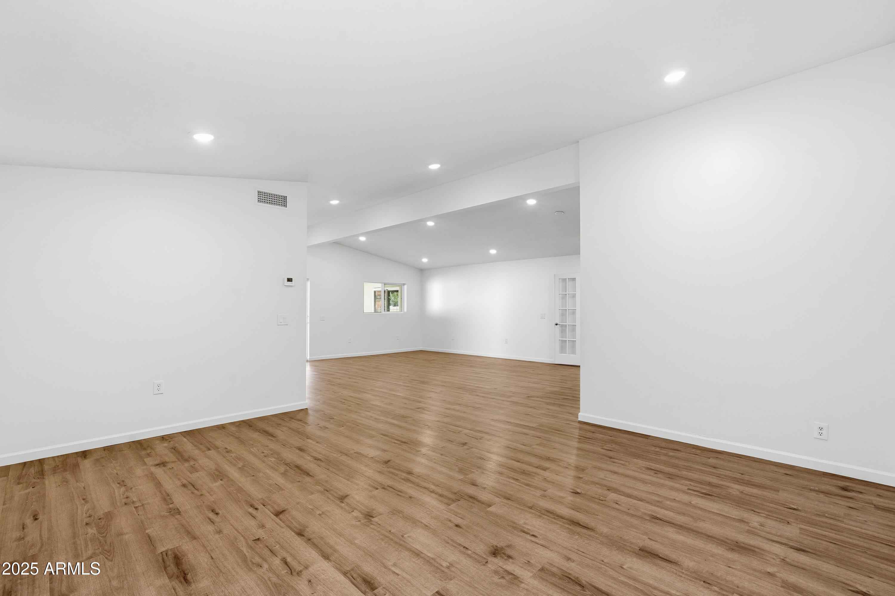 21047 South 156th Street Gilbert, AZ 85298 - Photo 5 of 40 a view of empty room with wooden floor