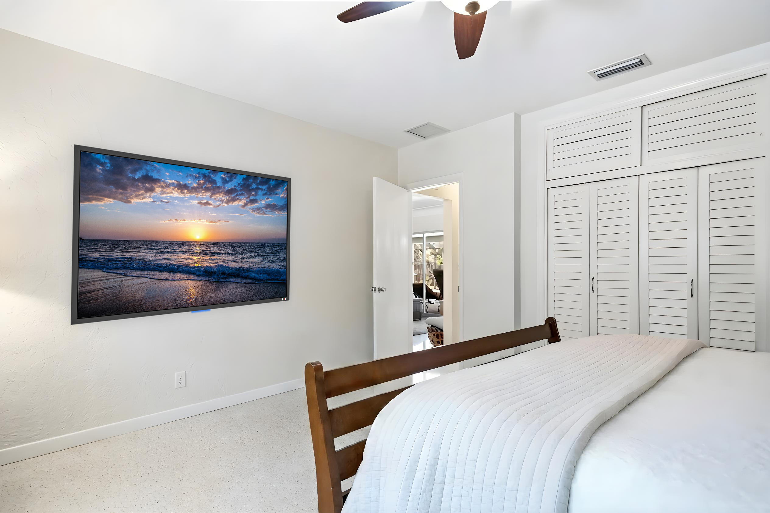 1348 Southwest 4th Street Boca Raton, FL 33486 - Photo 21 of 44 a bedroom with a bed and a painting on the wall