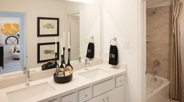 an aerial view of a house with a garden and lake view