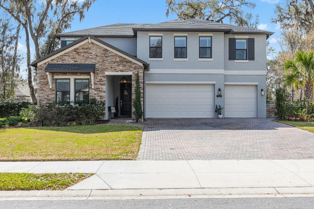 928 Southeast 42nd Street Ocala, FL 34480 - Photo 1 of 1 a front view of a house with a yard and garage
