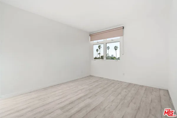 a bathroom with a shower and toilet