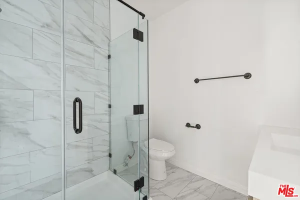 a view of a large building with a tree in front of it