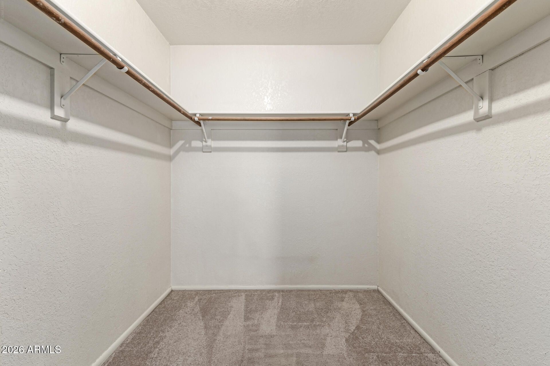 7926 West Shangri-la Road Peoria, AZ 85345 - Photo 18 of 32 a view of an empty walk in closet