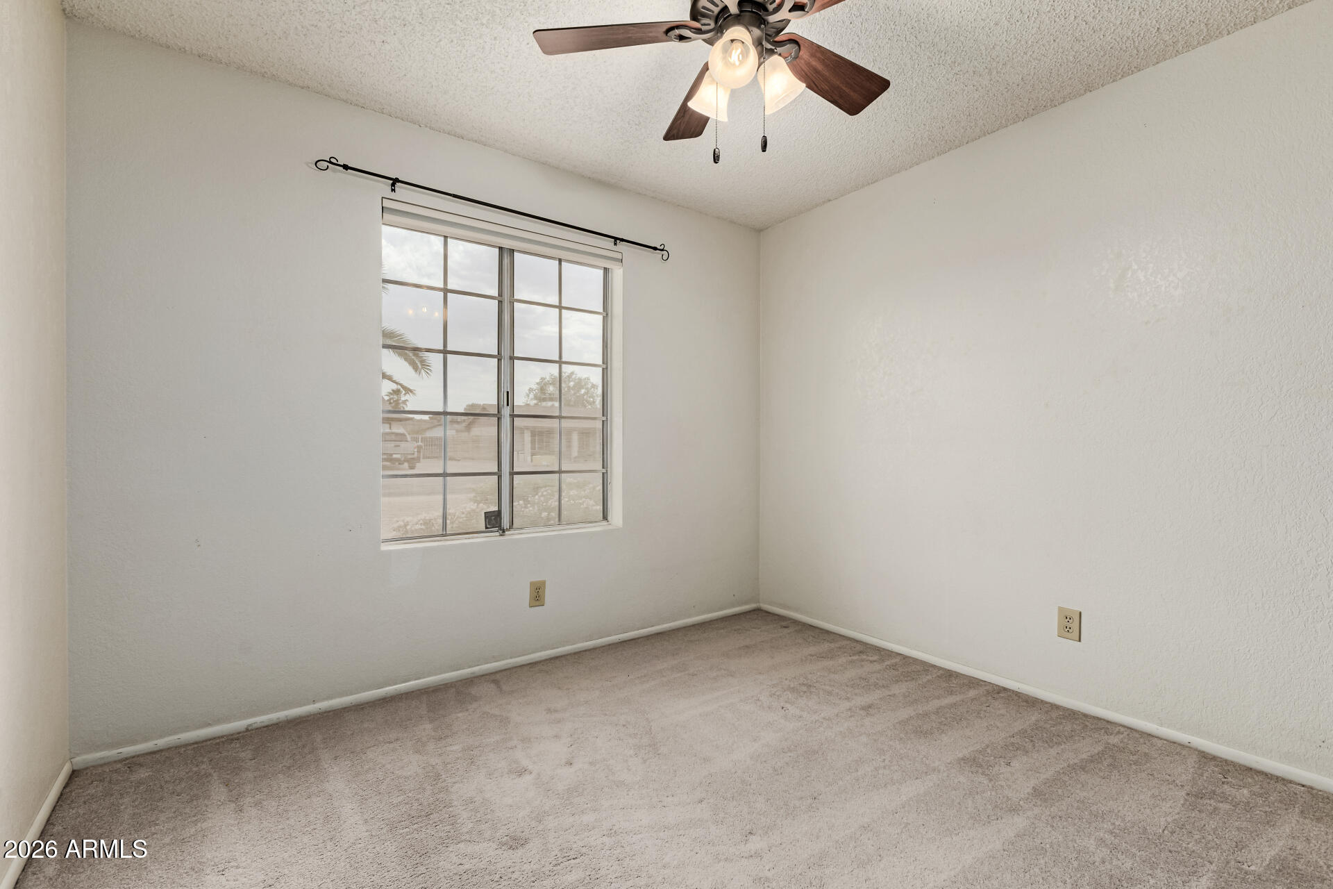 7926 West Shangri-la Road Peoria, AZ 85345 - Photo 19 of 32 a view of an empty room with a window