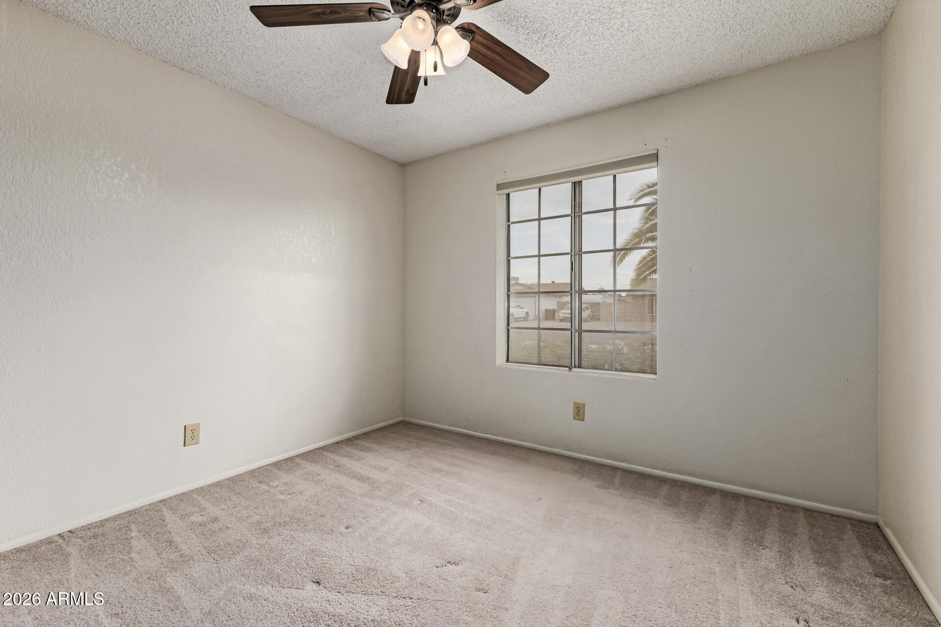 7926 West Shangri-la Road Peoria, AZ 85345 - Photo 21 of 32 an empty room with a window