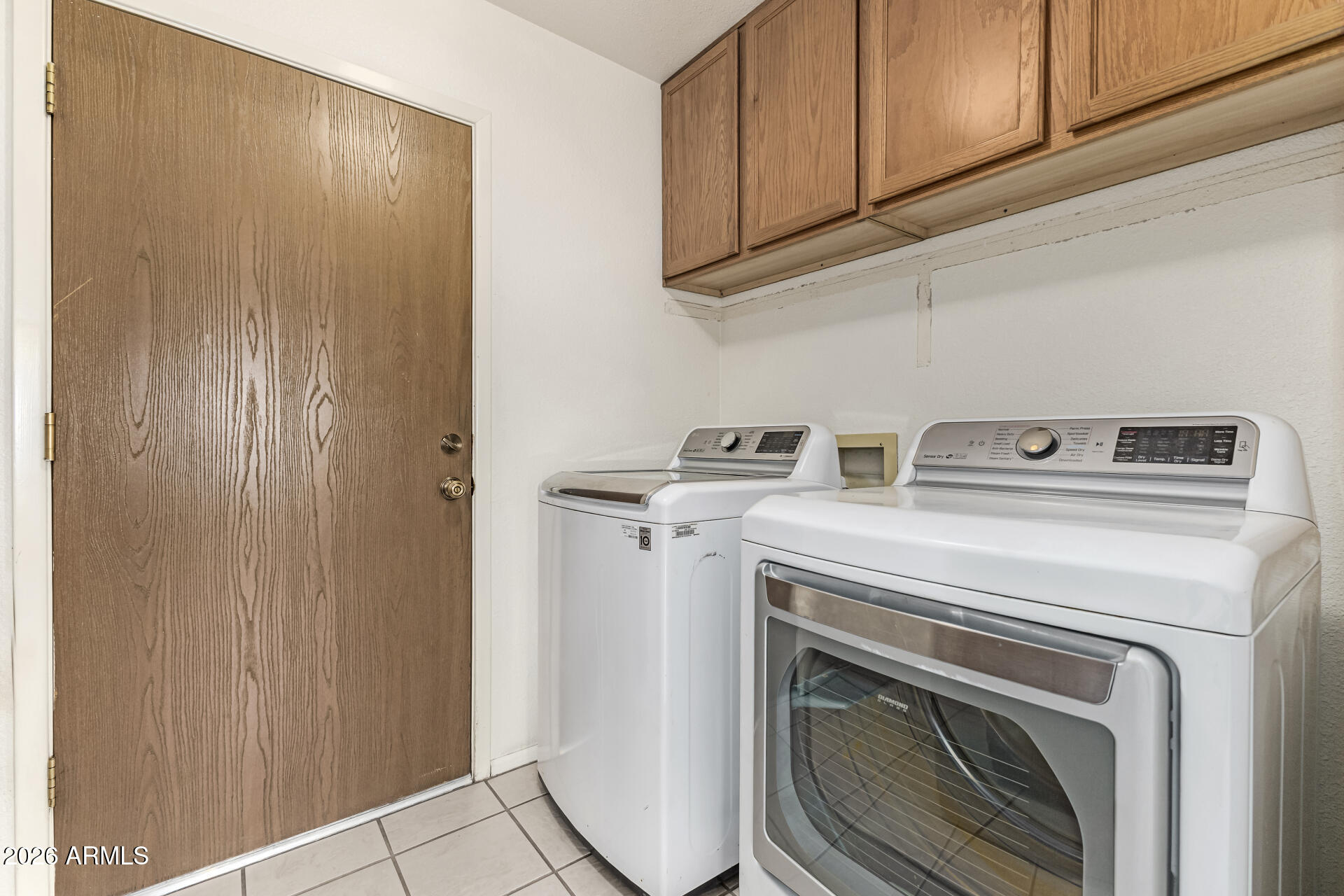 7926 West Shangri-la Road Peoria, AZ 85345 - Photo 26 of 32 a utility room with dryer and washer