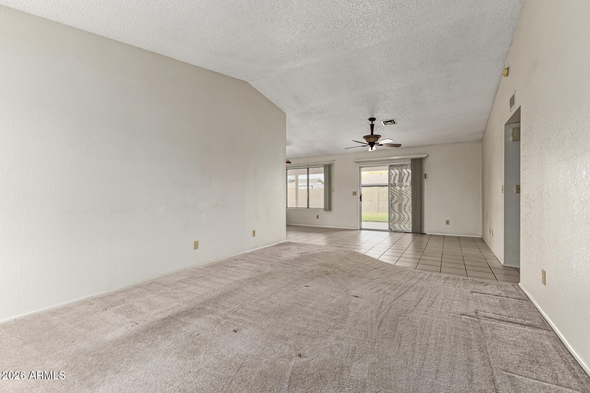 7926 West Shangri-la Road Peoria, AZ 85345 - Photo 4 of 32 a view of an empty room with a window
