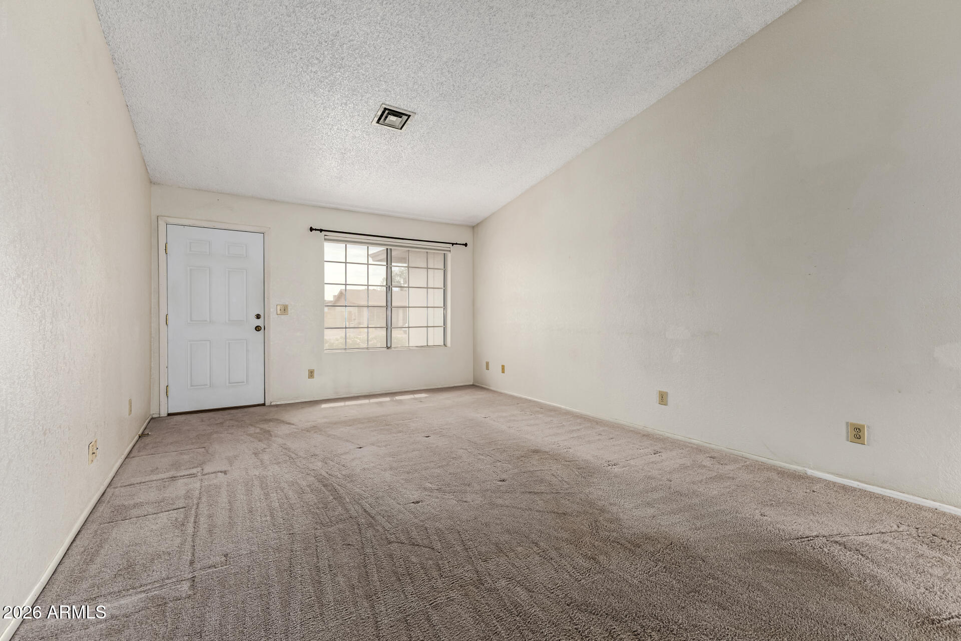 7926 West Shangri-la Road Peoria, AZ 85345 - Photo 6 of 32 an empty room with windows