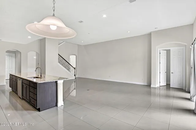 a view of a kitchen with a sink and a stove