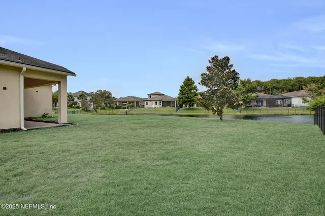 a backyard of a house with lots of green space