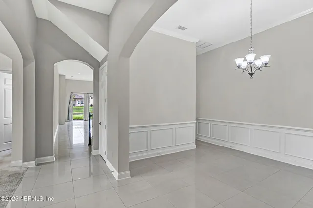 a view of an empty room with glass door