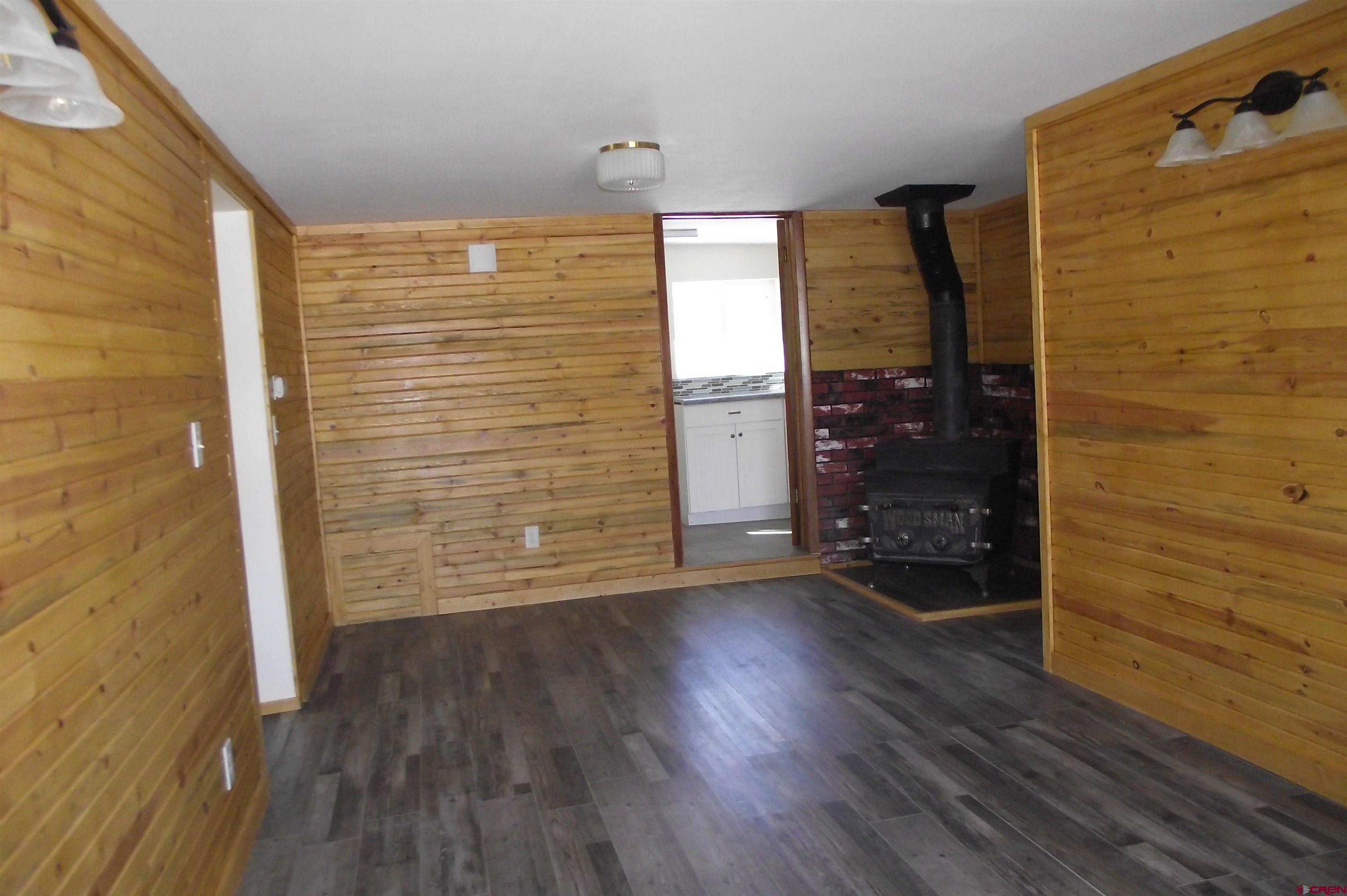 27434 Cedar Mesa Road Cedaredge, CO 81413 - Photo 19 of 36 wooden floor in an empty room