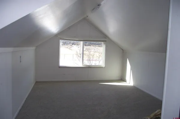 a view of empty room with windows