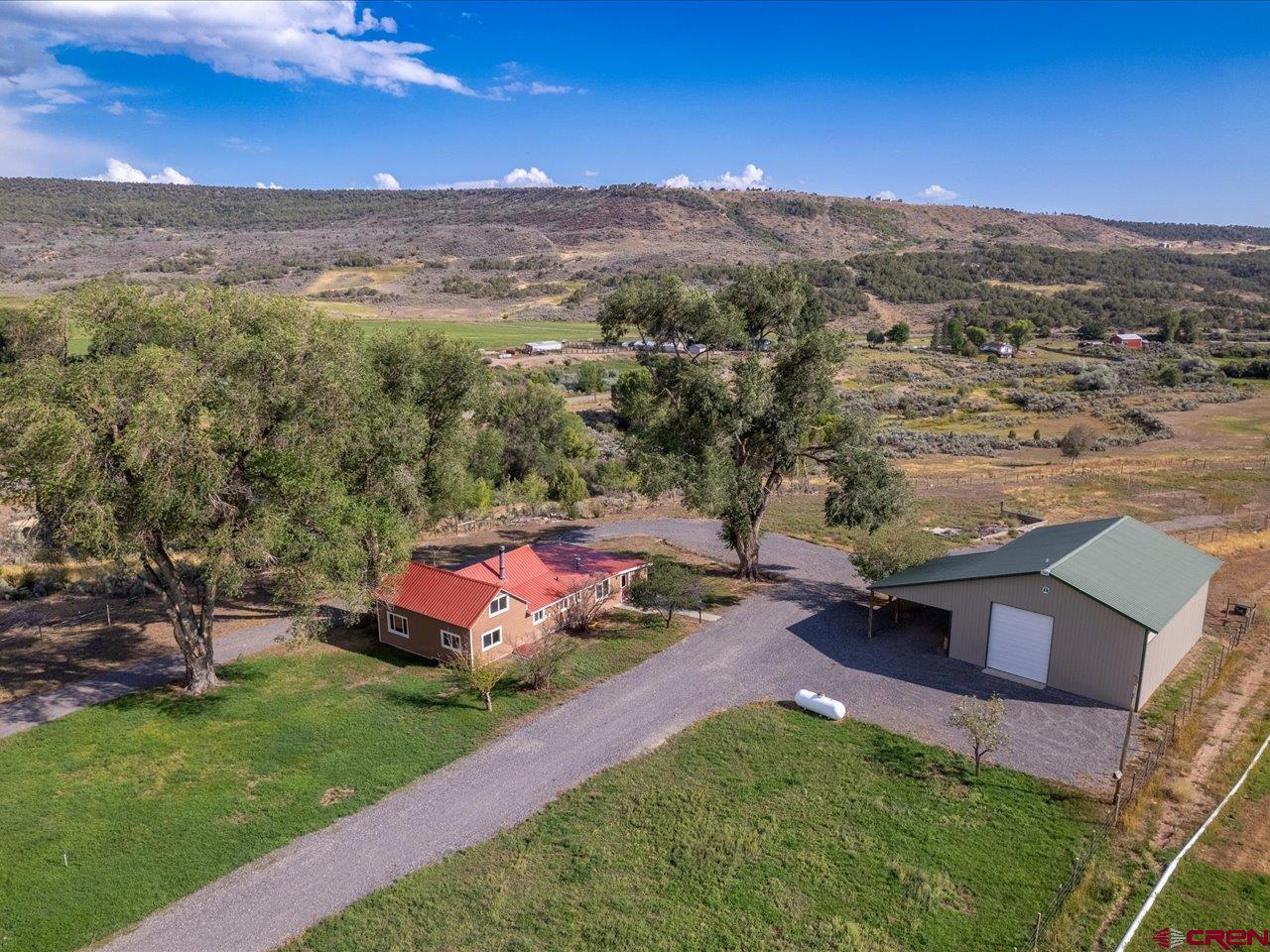 27434 Cedar Mesa Road Cedaredge, CO 81413 - Photo 3 of 36 a view of a city with mountain