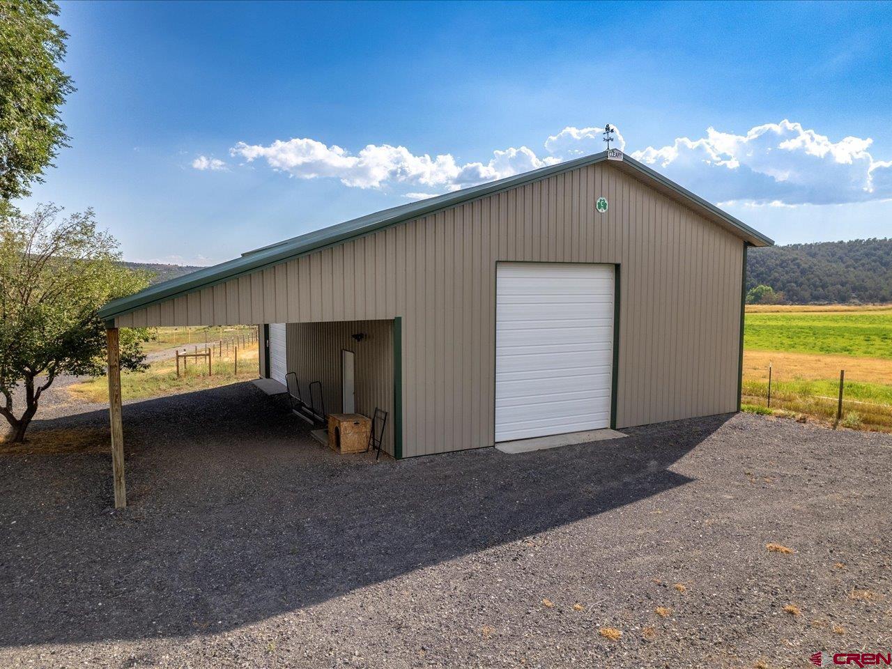 27434 Cedar Mesa Road Cedaredge, CO 81413 - Photo 8 of 36 a view of a house with backyard