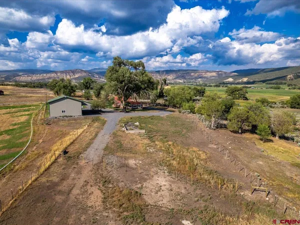 a living room with furniture and a gate