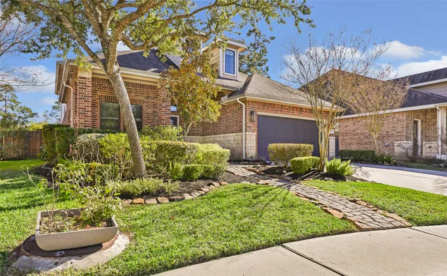 a view of a house with a yard and plants