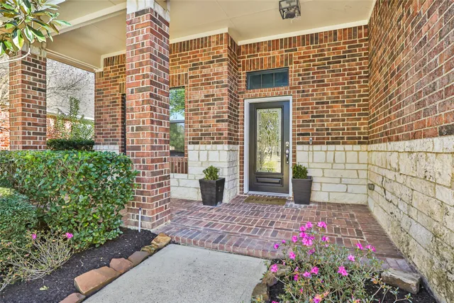a view of house with flower pots