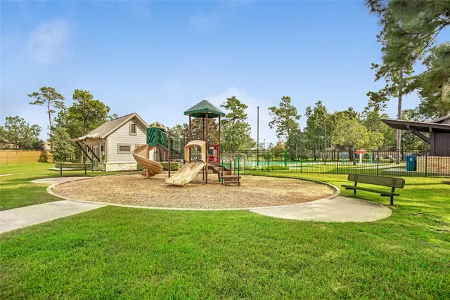 a view of a swimming pool with a yard