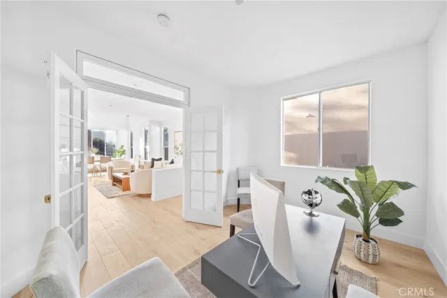 a kitchen with white cabinets and appliances