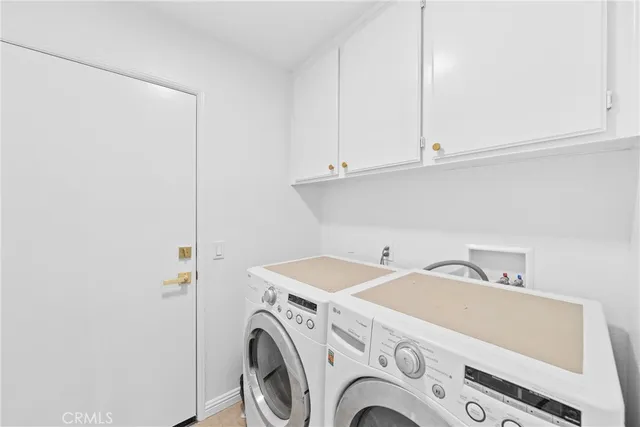 a spacious bedroom with a bed and a window