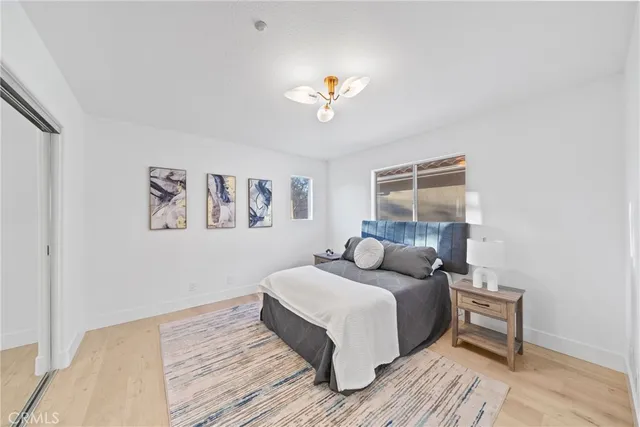 a bathroom with a double vanity sink mirror and shower
