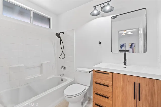 a bathroom with a double vanity sink mirror double and bathtub