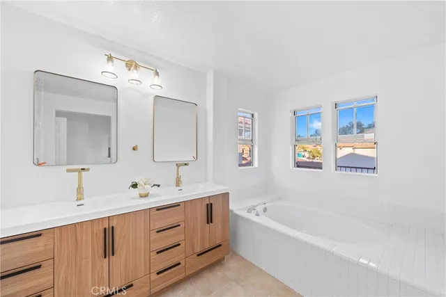 a front view of house with yard and mountain view in back