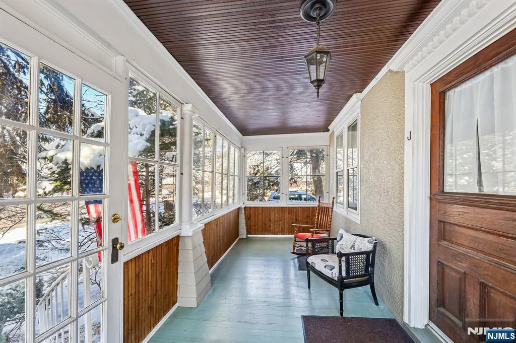 133 Hudson Avenue Ridgefield Park, NJ 07660 - Photo 2 of 14 a yellow room with wooden floor and furniture