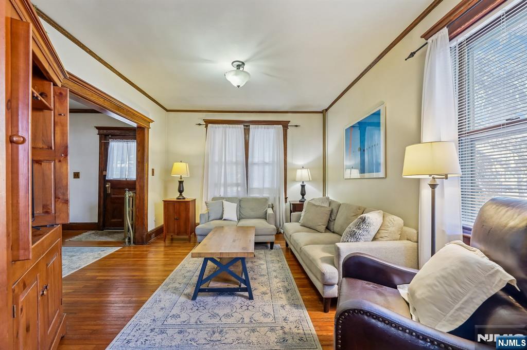 133 Hudson Avenue Ridgefield Park, NJ 07660 - Photo 3 of 14 a living room with furniture and a lamp
