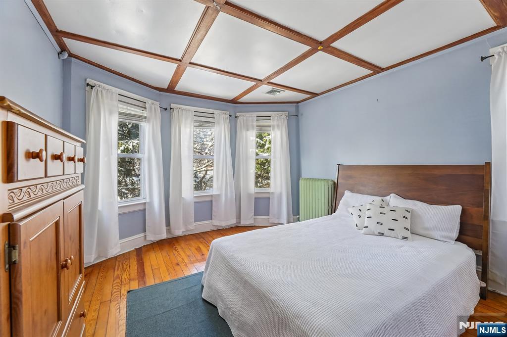 133 Hudson Avenue Ridgefield Park, NJ 07660 - Photo 10 of 14 a bedroom with a large bed and a large window