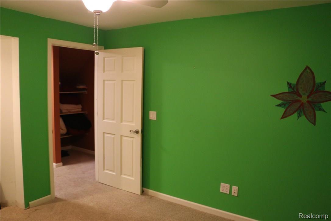 9404 Mabley Hill Road Fenton, MI 48430 - Photo 35 of 46 Extra room in the basement (we can't call it a bedroom because there isn't a window, but it is 12x12 with a closet)