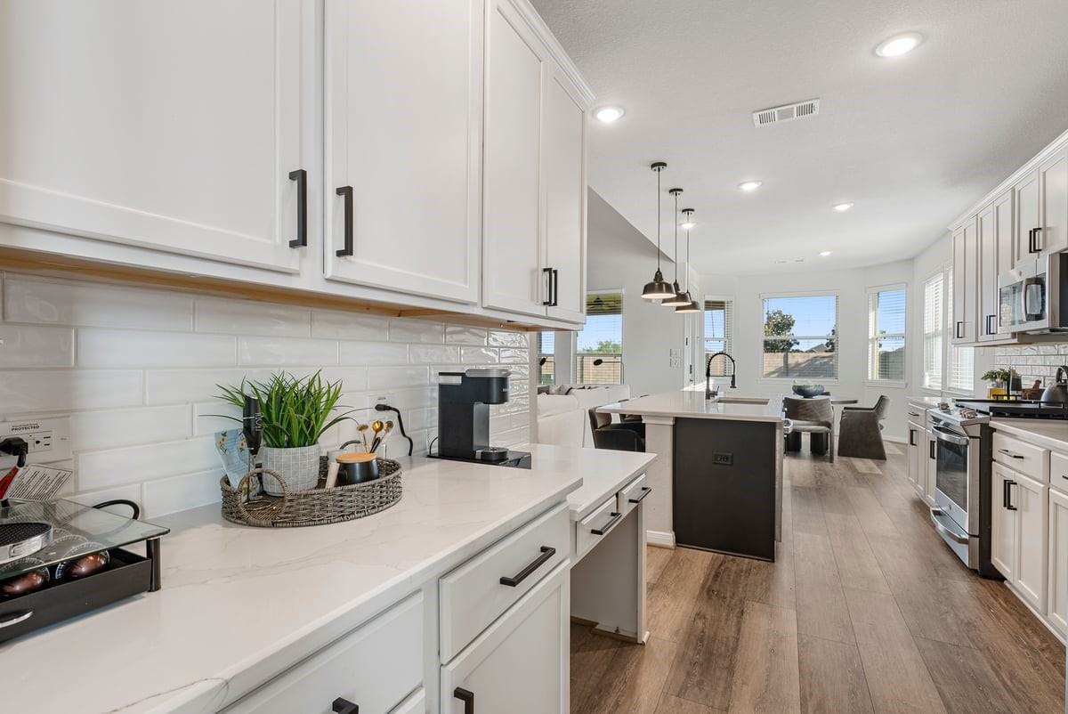 1702 Darwin Cedar Drive Rosharon, TX 77583 - Photo 19 of 44 The kitchen has a masterful design with an additional pantry area and built in desk!