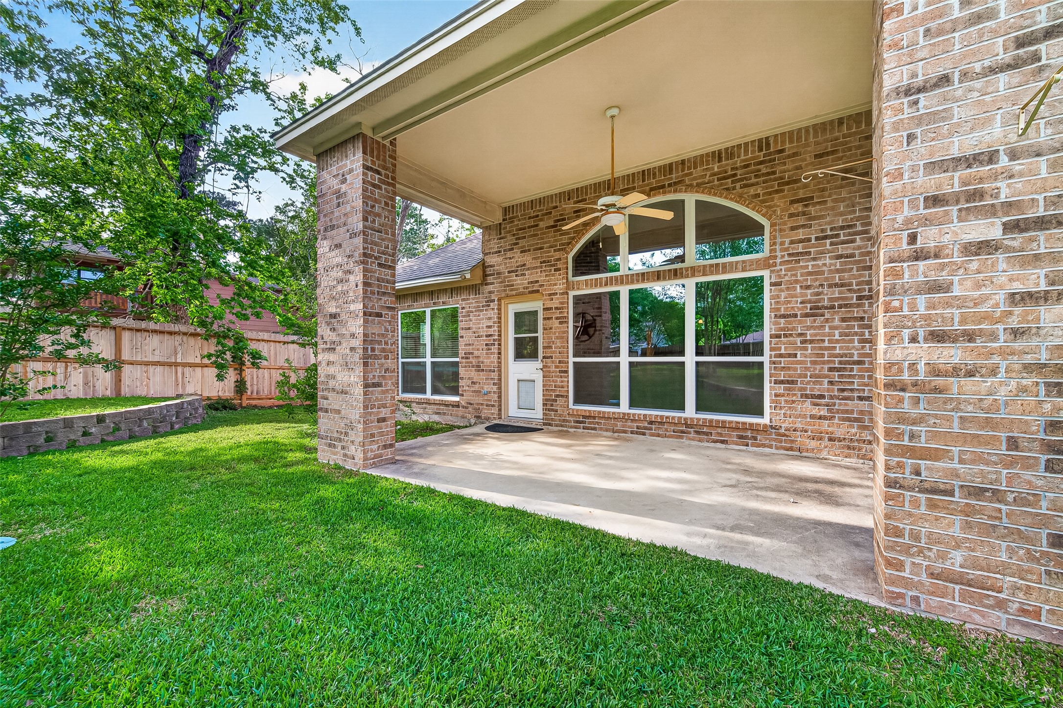 1514 Melissa Drive Spring, TX 77386 - Photo 19 of 20 Enjoy the views of the back yard from the patio with a high ceiling.