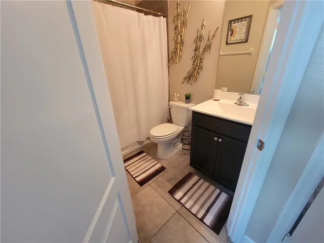 a room with a table and a potted plant