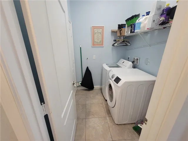 a view of house with backyard and garden