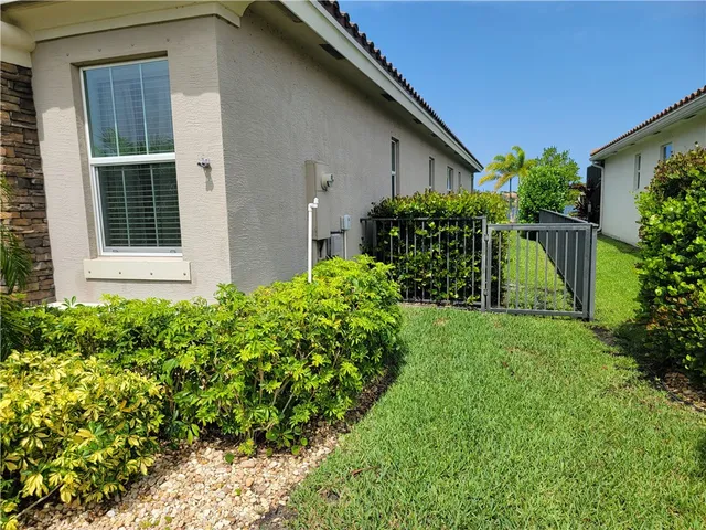a backyard of a house with lots of green space