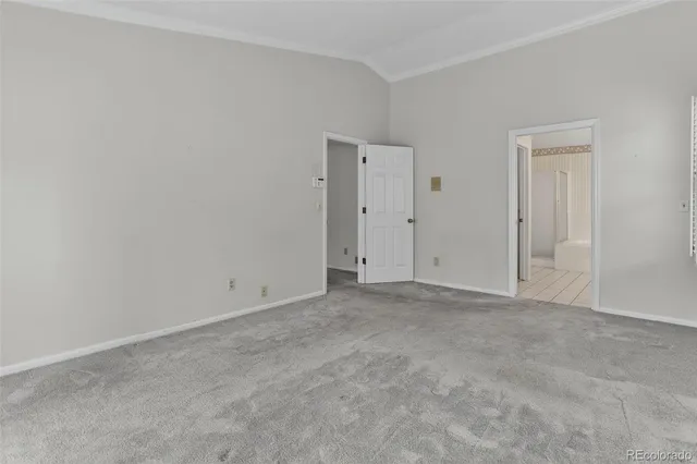 an empty room with closet area