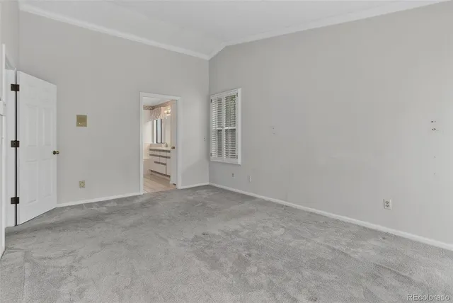 an empty room with closet area