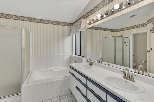 a bathroom with a bathtub and shower